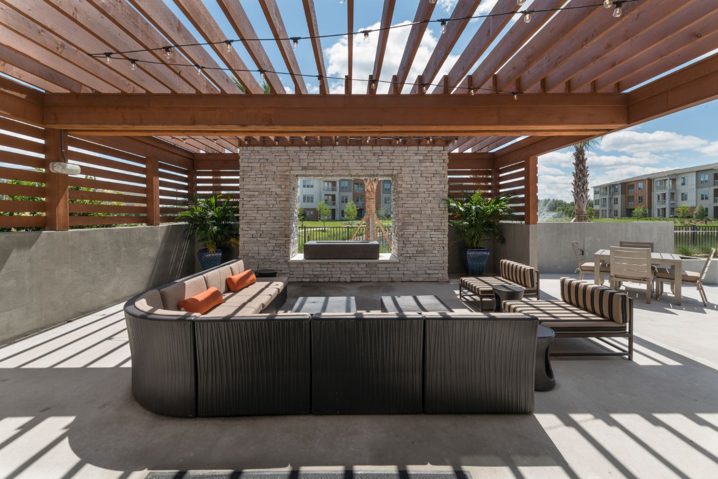 Outdoor seating under pergola, example of hardscaping